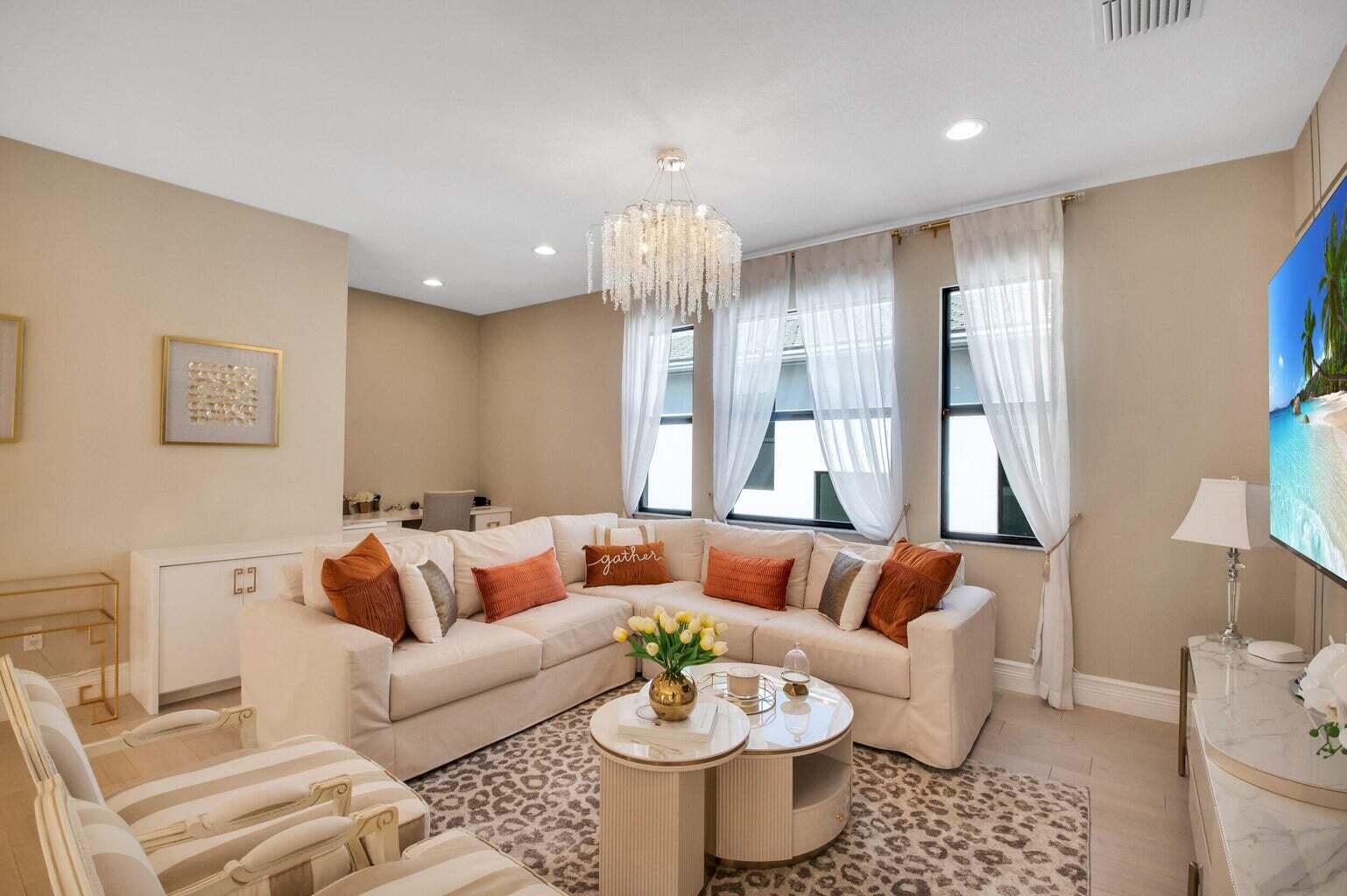 9016 Chauvet Way Boca Raton, FL 33496 - Photo 37 of 79 a living room with furniture and a chandelier