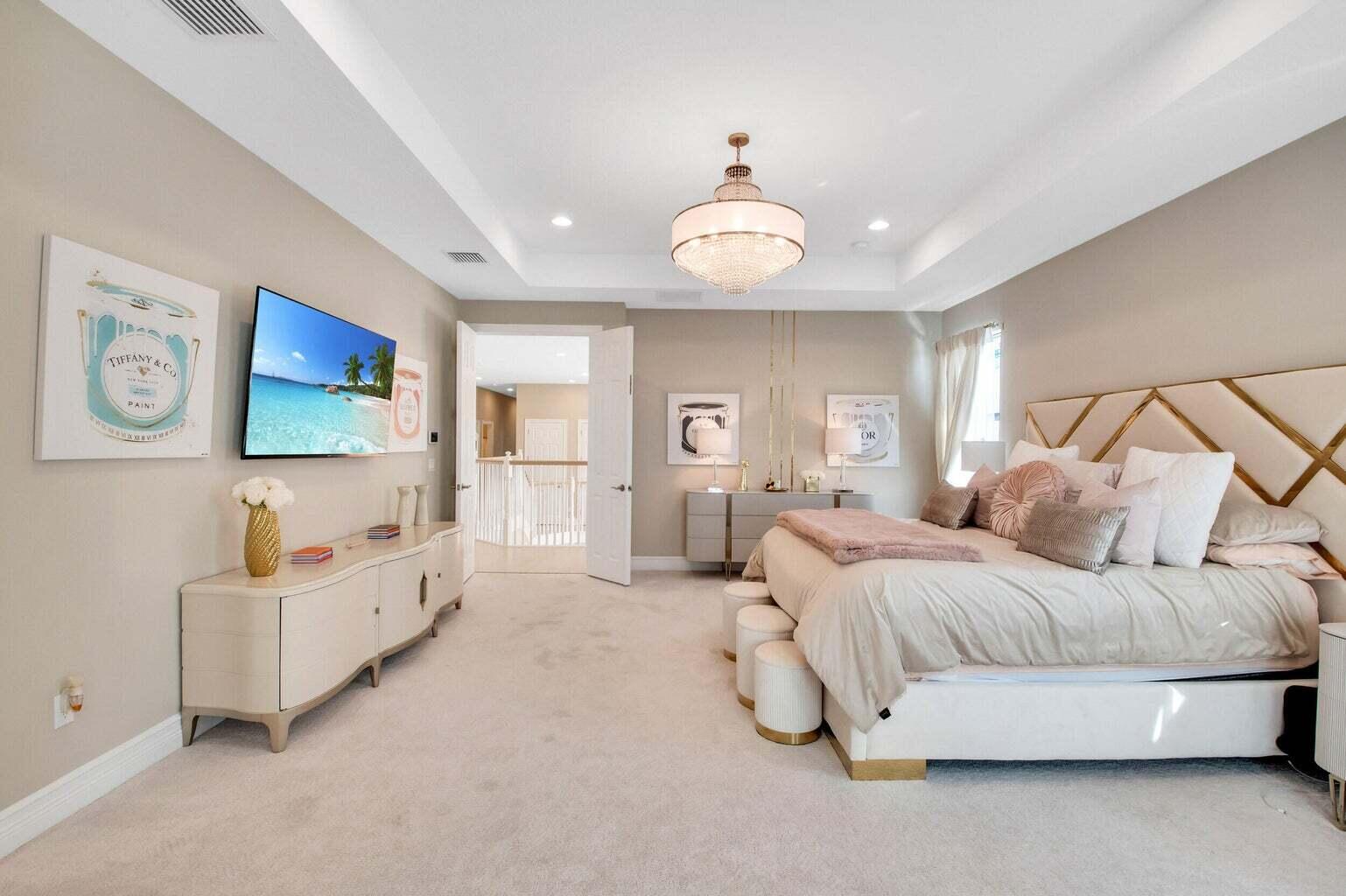 9016 Chauvet Way Boca Raton, FL 33496 - Photo 42 of 79 a spacious bedroom with a bed and ceiling fan