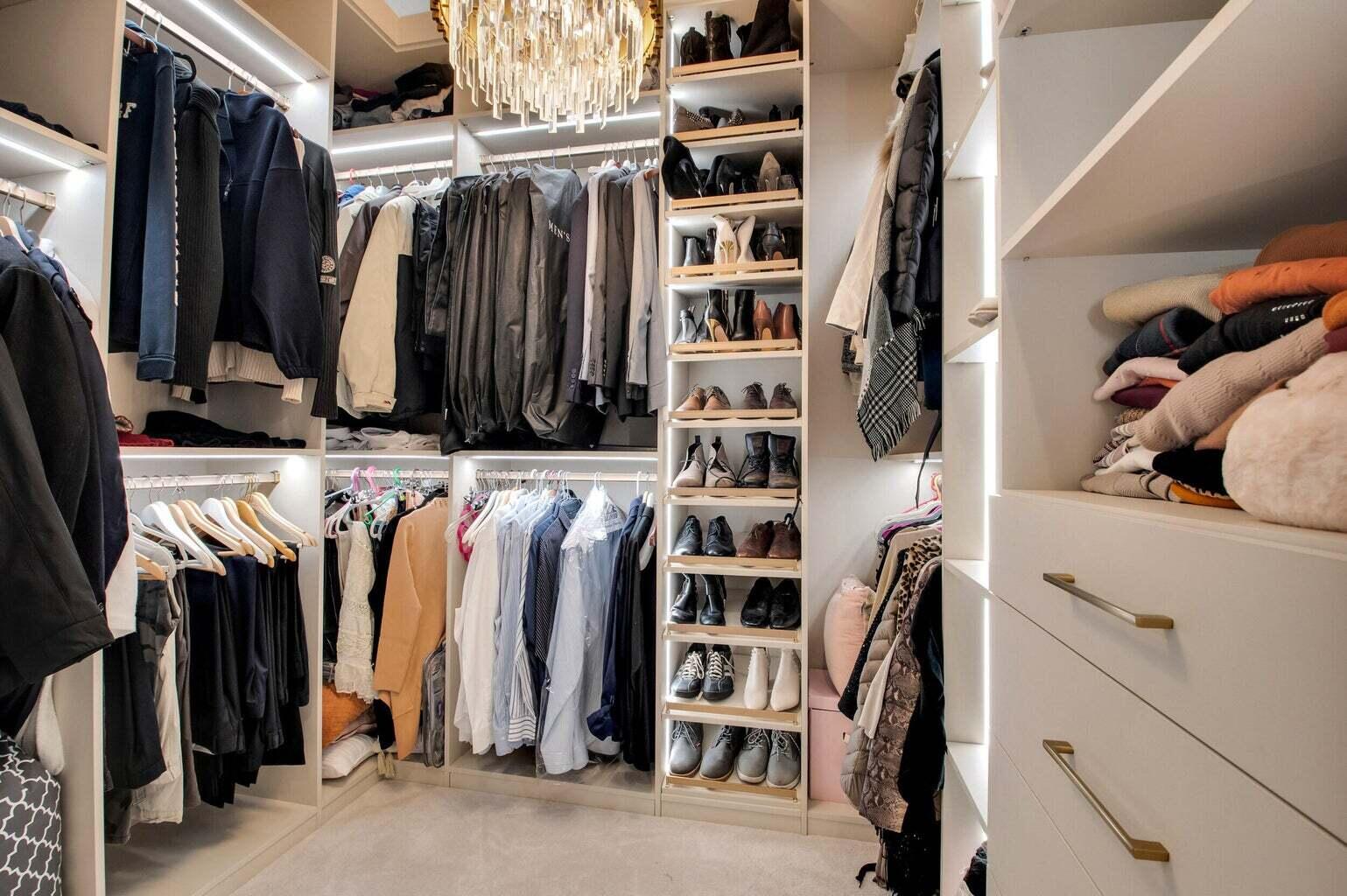 9016 Chauvet Way Boca Raton, FL 33496 - Photo 45 of 79 a view of walk in closet with clothes and shoes