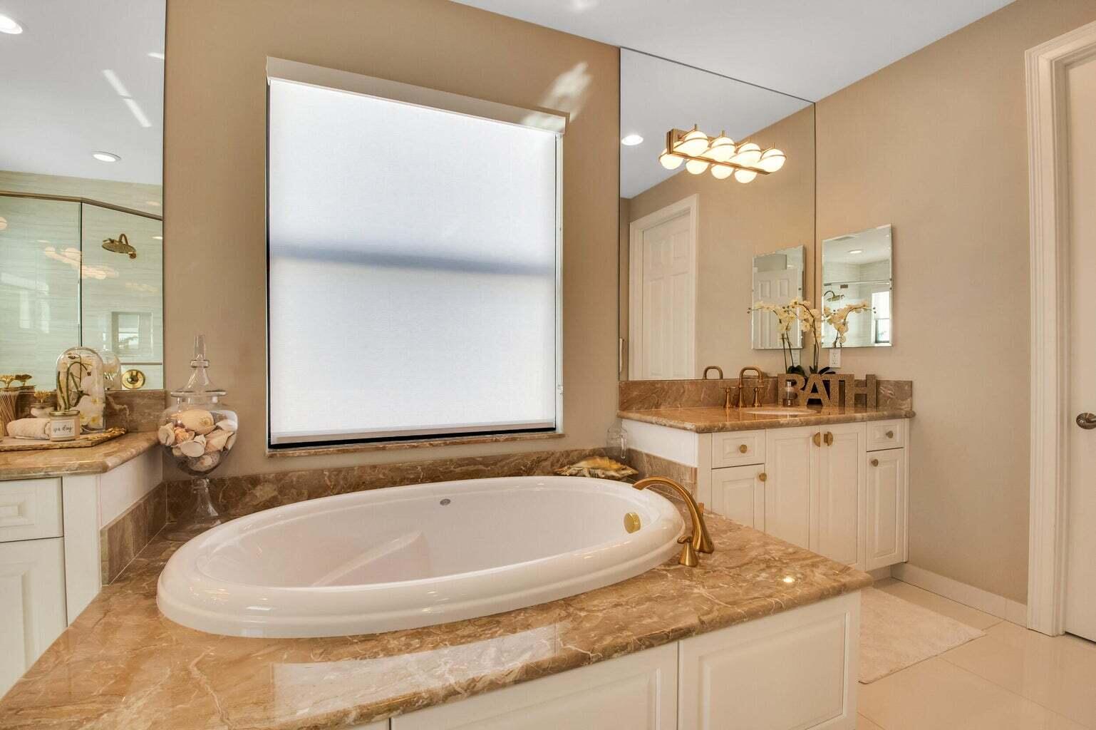 9016 Chauvet Way Boca Raton, FL 33496 - Photo 46 of 79 a bathroom with a granite countertop sink and a mirror