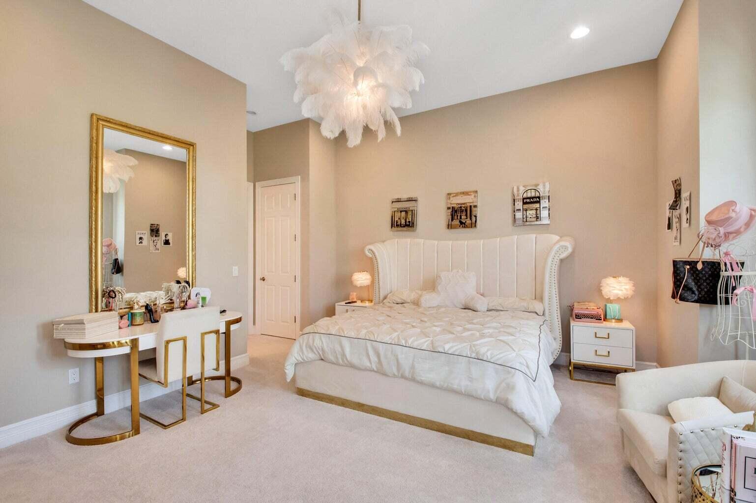 9016 Chauvet Way Boca Raton, FL 33496 - Photo 54 of 79 a bedroom with a bed and a chandelier
