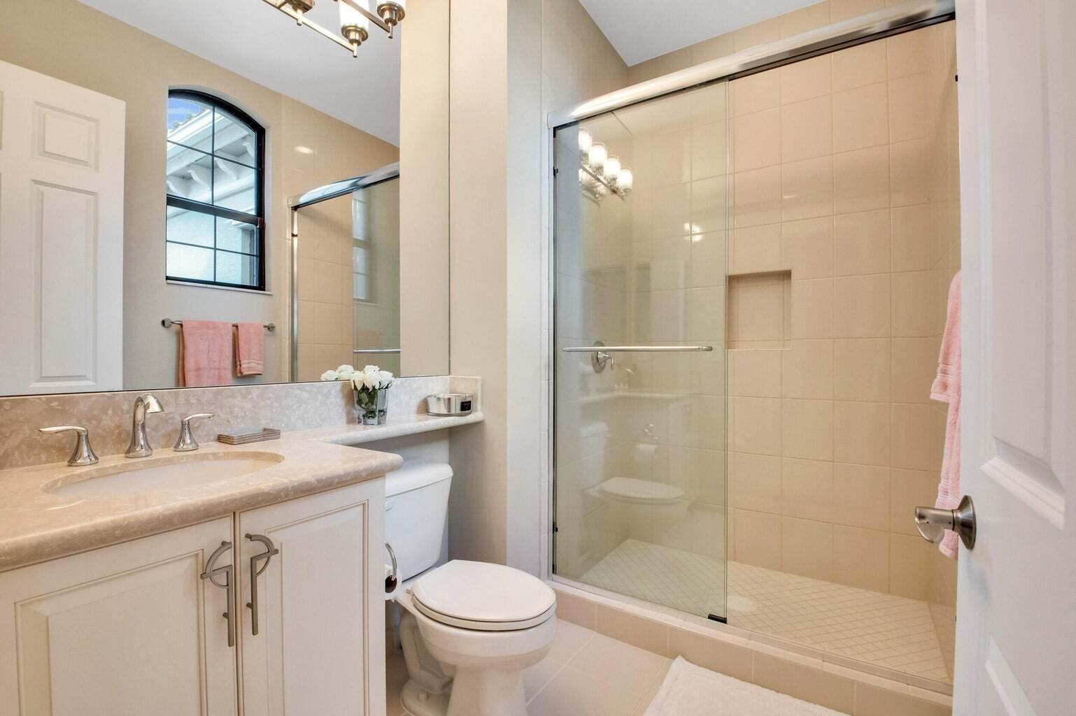 9016 Chauvet Way Boca Raton, FL 33496 - Photo 60 of 79 a bathroom with a sink toilet and shower
