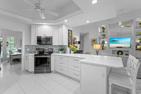 a kitchen with a table and chairs