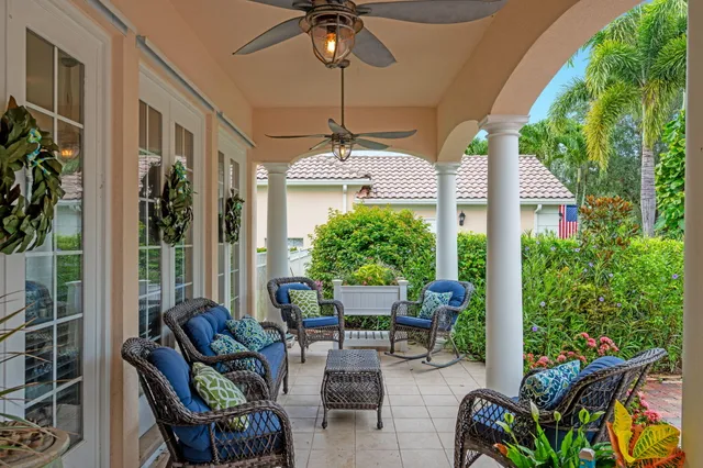 an aerial view of residential houses with outdoor space and ocean view
