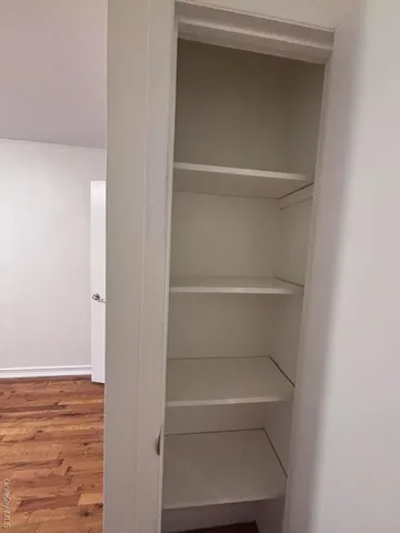 a view of an empty walk in closet