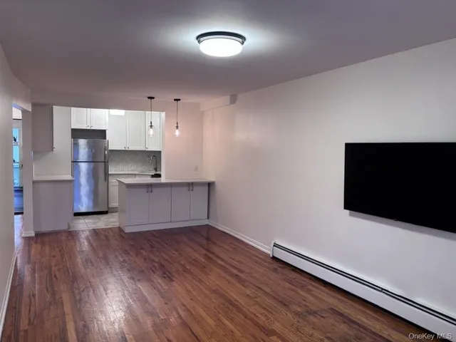 a kitchen with stainless steel appliances a refrigerator and a microwave
