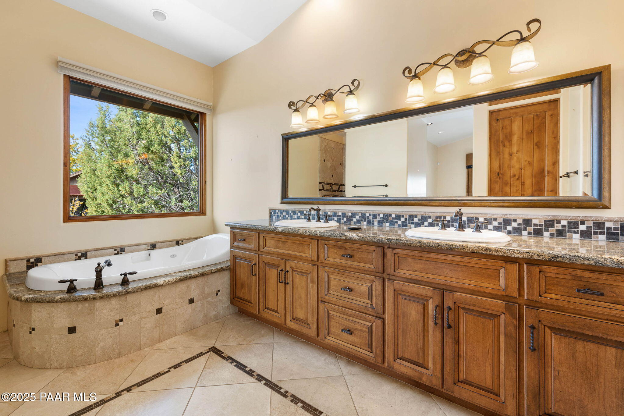 14850 Jay Morrish Drive Prescott, AZ 86305 - Photo 11 of 49 a bathroom with a tub sink and mirror