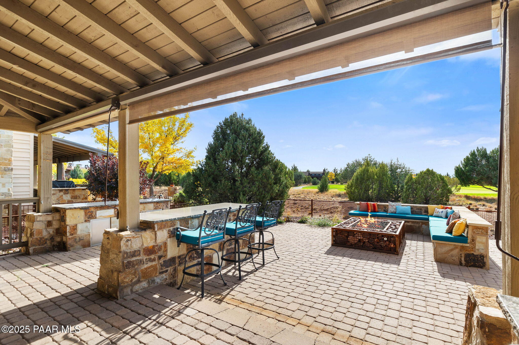14850 Jay Morrish Drive Prescott, AZ 86305 - Photo 25 of 49 a view of a patio with couches dining table and chairs with wooden floor and fence
