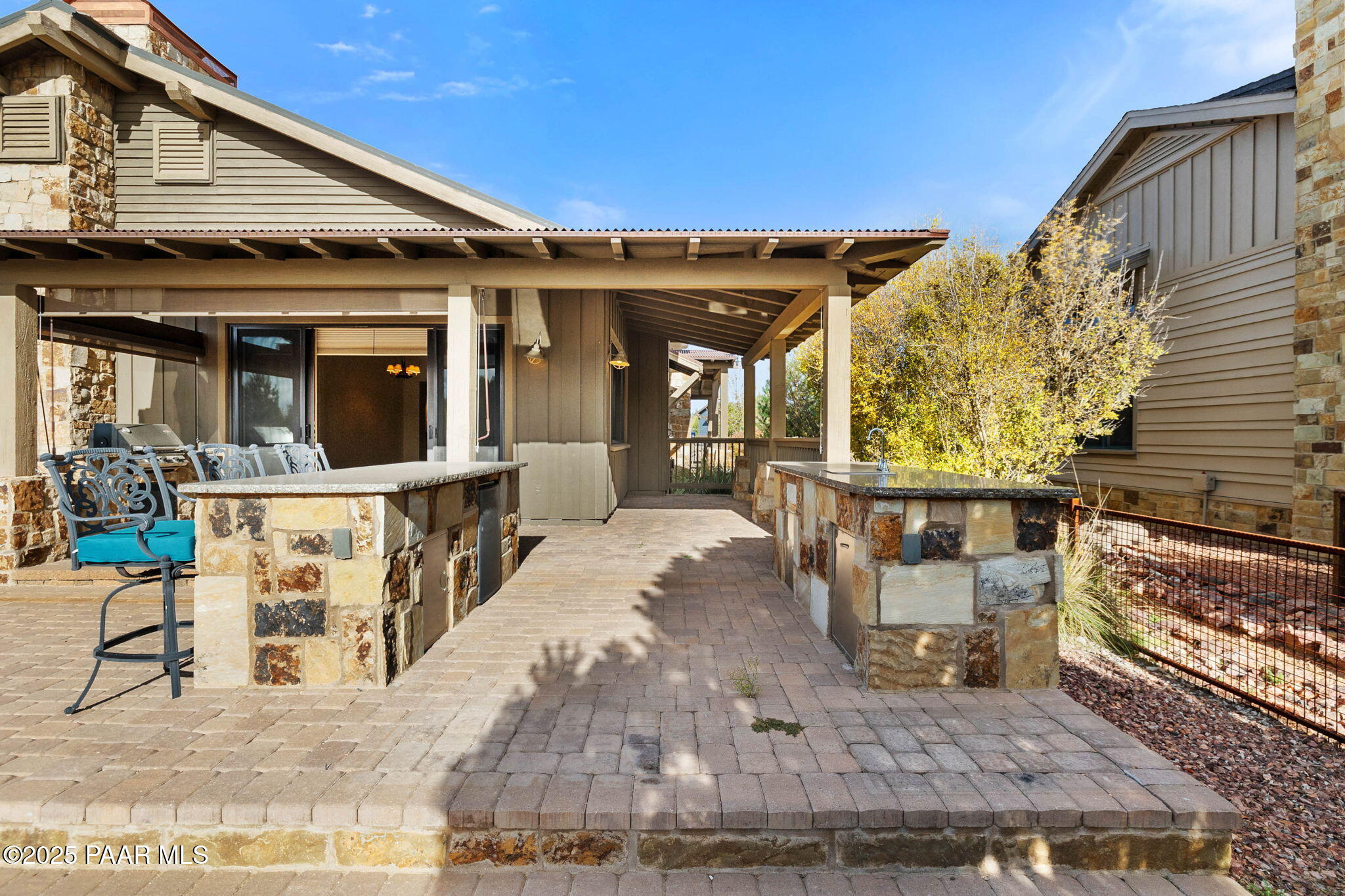 14850 Jay Morrish Drive Prescott, AZ 86305 - Photo 26 of 49 a view of a patio with table and chairs with wooden floor and plants