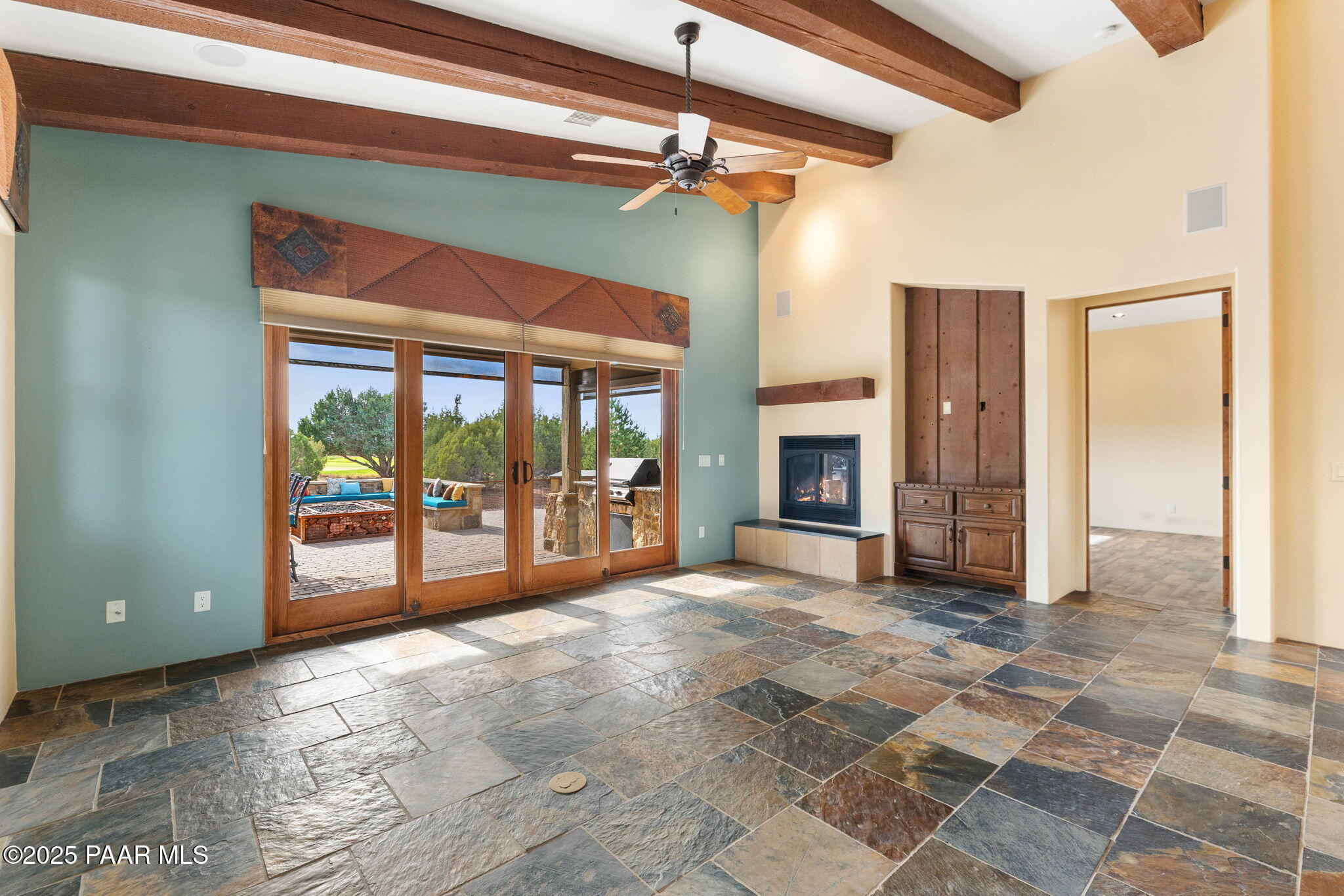 14850 Jay Morrish Drive Prescott, AZ 86305 - Photo 6 of 49 a view of an empty room with a fireplace and a window