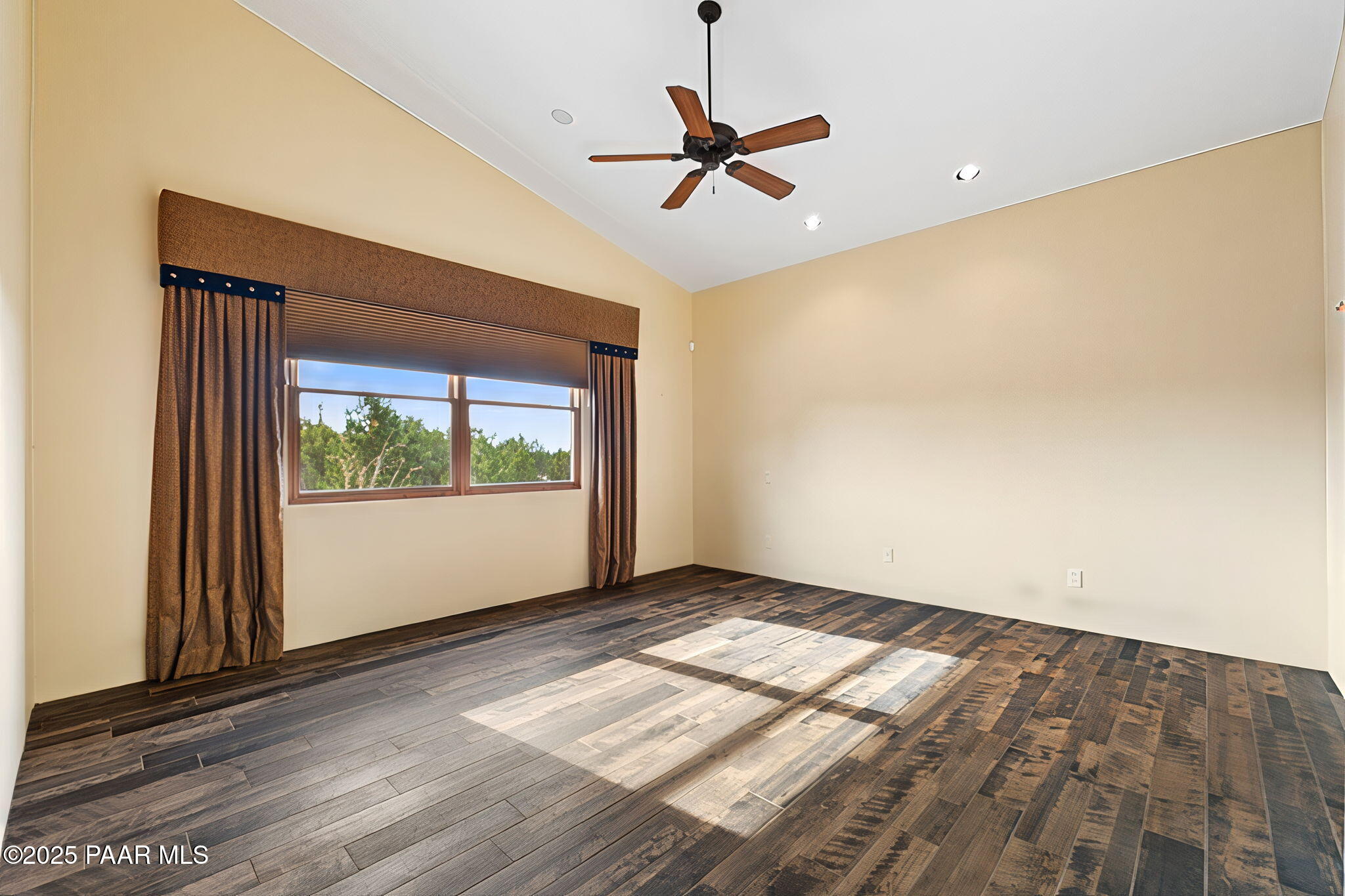14850 Jay Morrish Drive Prescott, AZ 86305 - Photo 10 of 49 a view of empty room with wooden floor and fan
