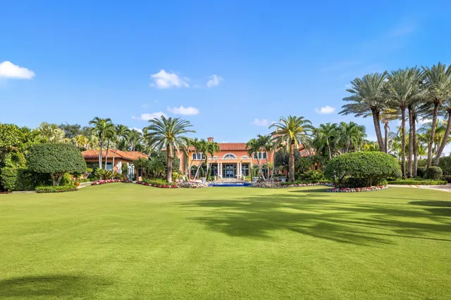 a view of swimming pool with a garden and outdoor seating