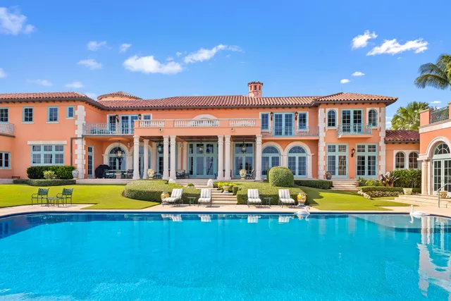 a view of a house with swimming pool and porch with furniture