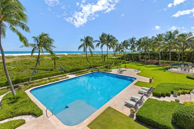a view of a swimming pool with a patio