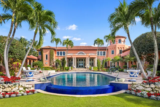 a front view of a house with outdoor space and lake view