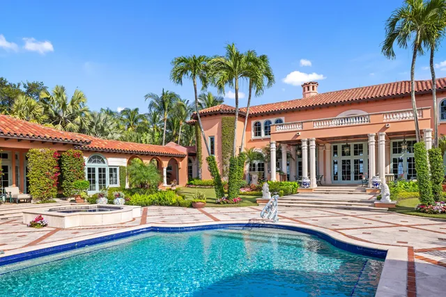 a view of a building with potted plants