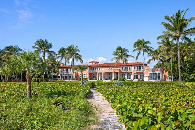 a view of an ocean beach and mountain