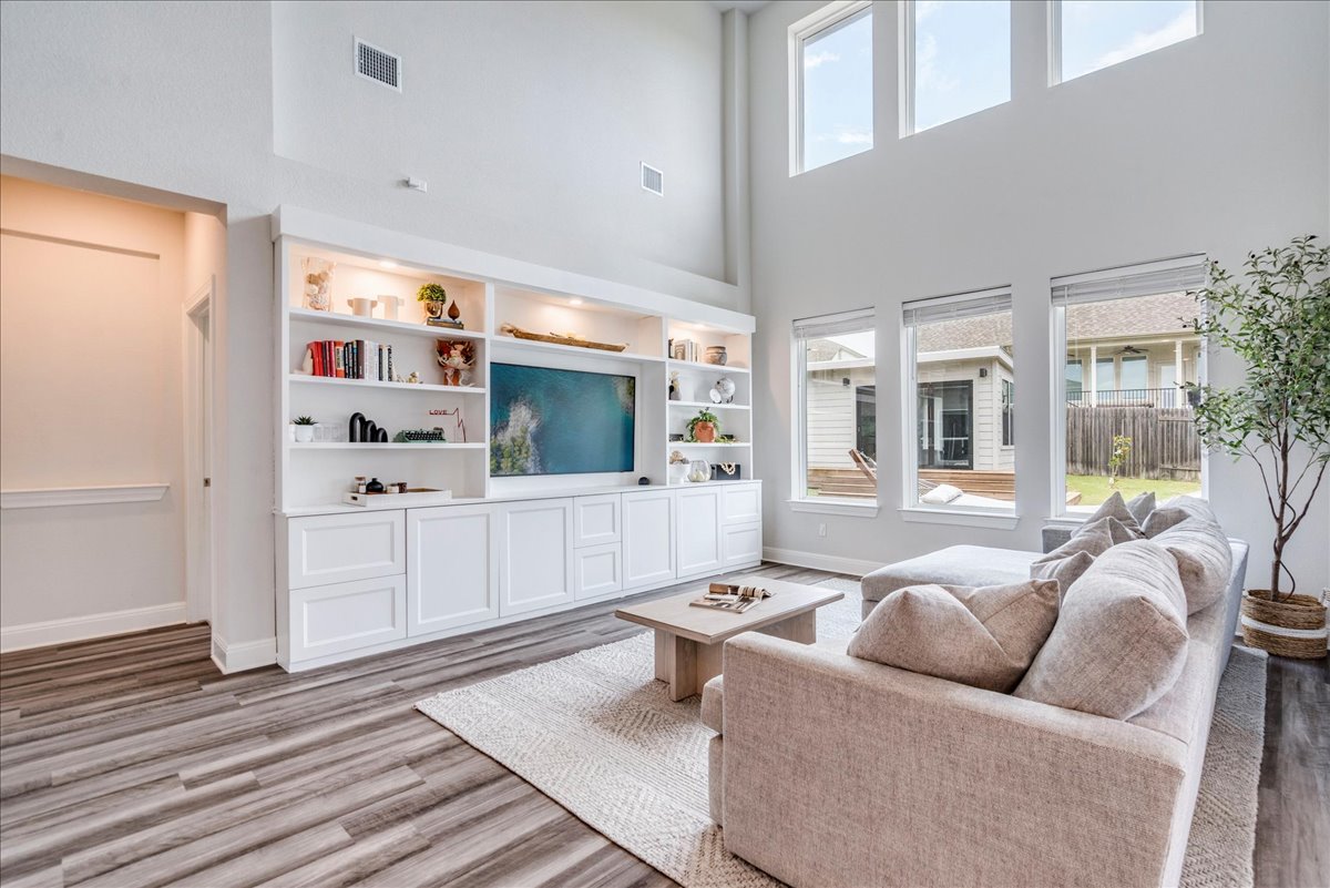 212 Sierra Blanca Road Dripping Springs, TX 78620 - Photo 13 of 37 Living room with tall ceilings and built ins.