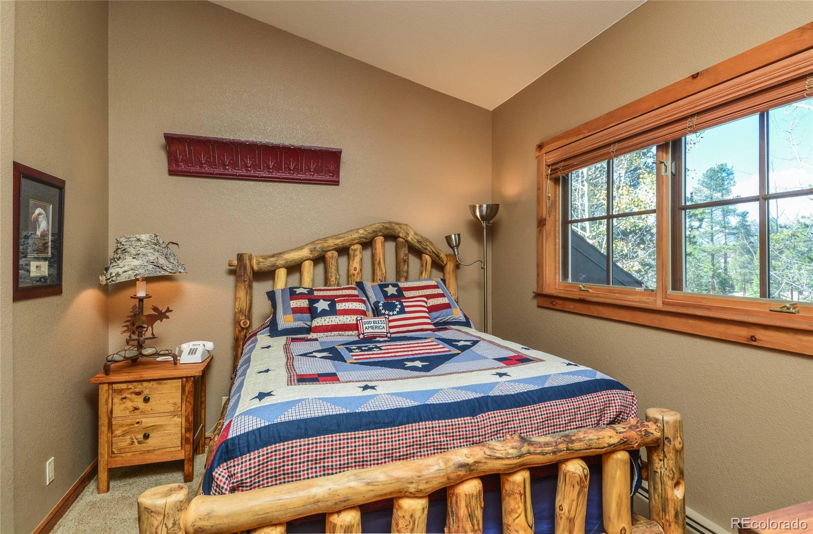 57 Lake Ridge Circle Keystone, CO 80435 - Photo 11 of 27 a bedroom with a bed and a large window