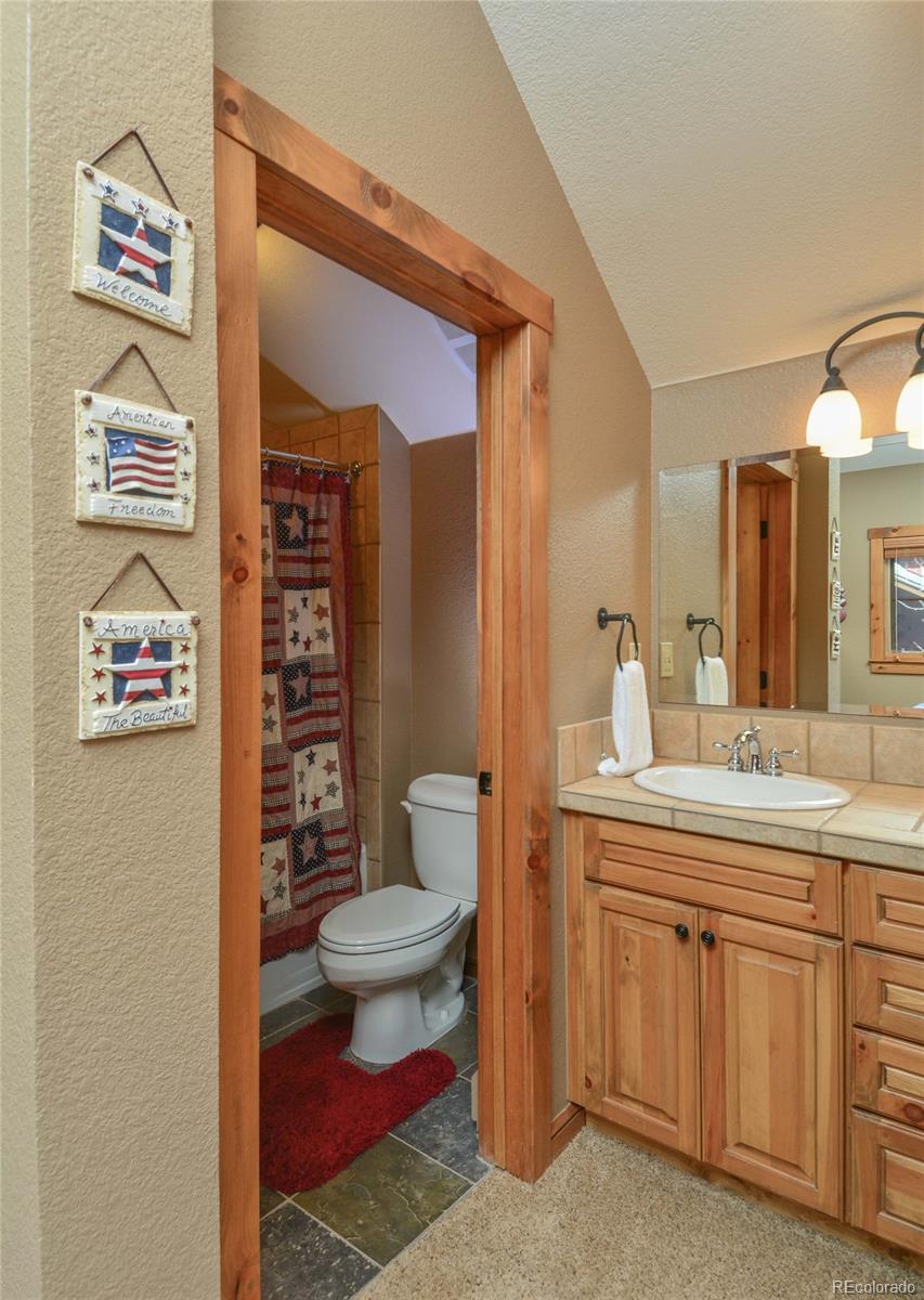 57 Lake Ridge Circle Keystone, CO 80435 - Photo 12 of 27 a bathroom with a sink and a mirror