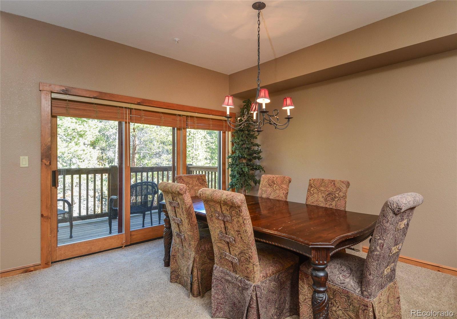 57 Lake Ridge Circle Keystone, CO 80435 - Photo 5 of 27 a view of a dining room with furniture window and outside view