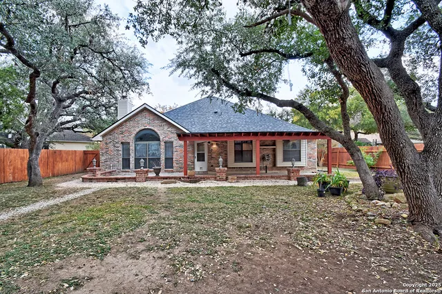 a front view of a house with yard porch and furniture