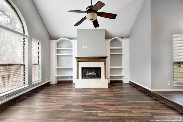 a living room with furniture and a fireplace
