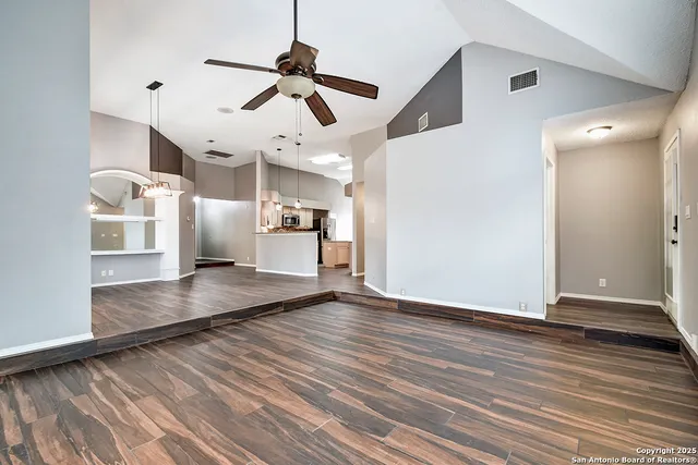 a view of livingroom and hardwood floor