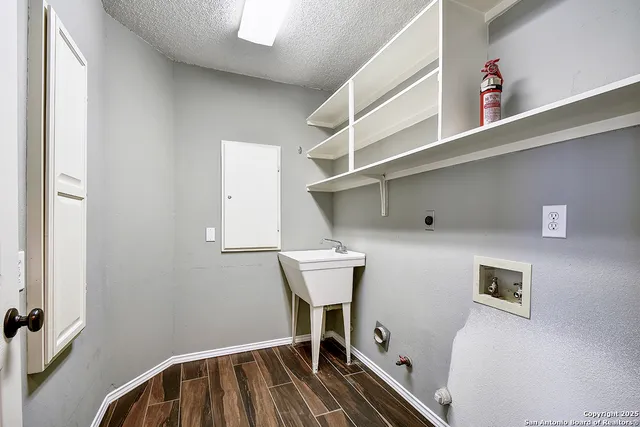 a view of a hallway with seating area
