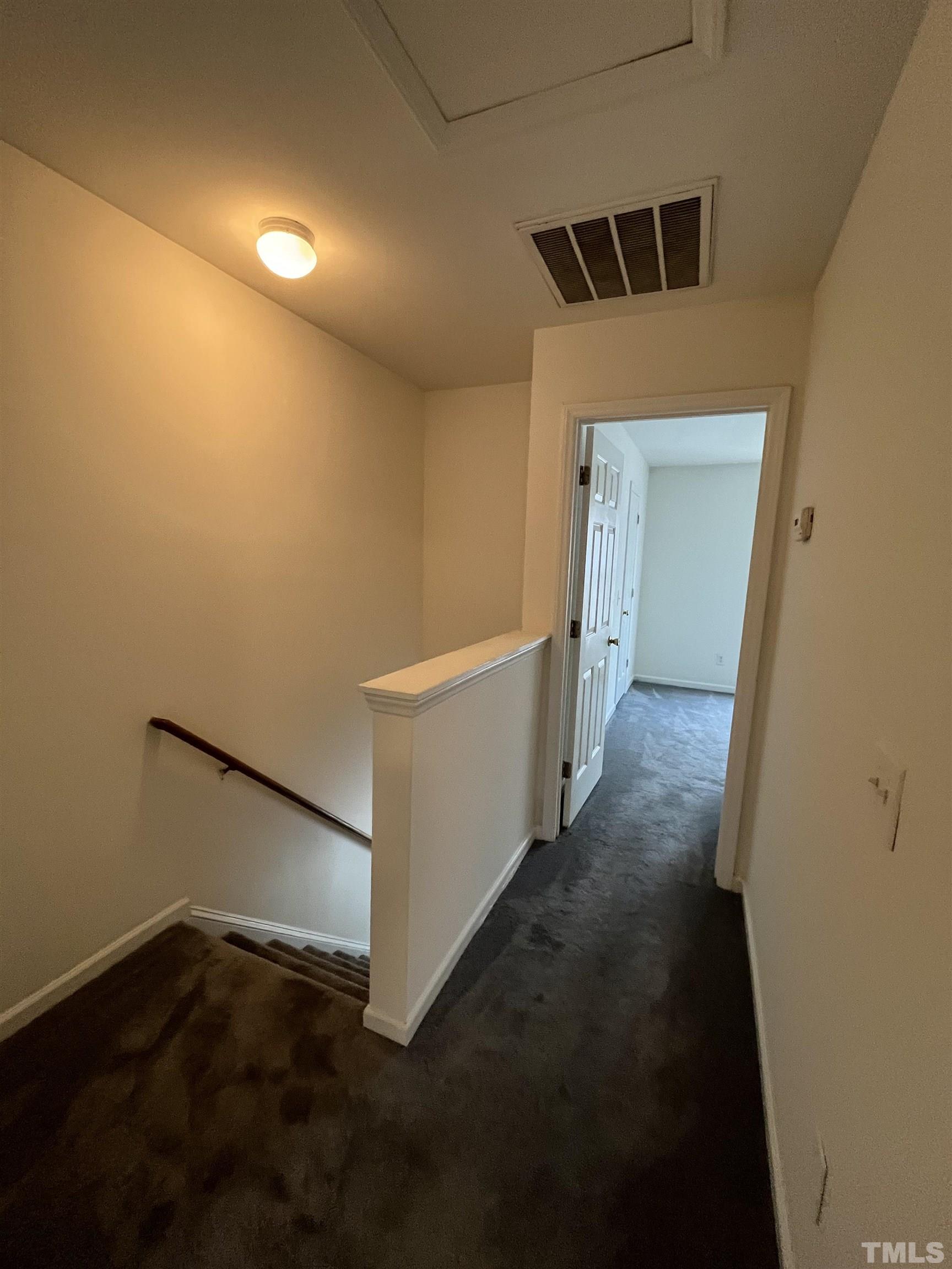 23 Red Lane Raleigh, NC 27606 - Photo 11 of 13 a view of a hallway with wooden floor