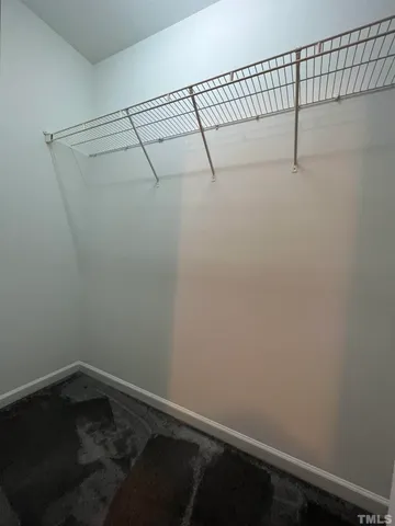 a view of a room with racks on the wall