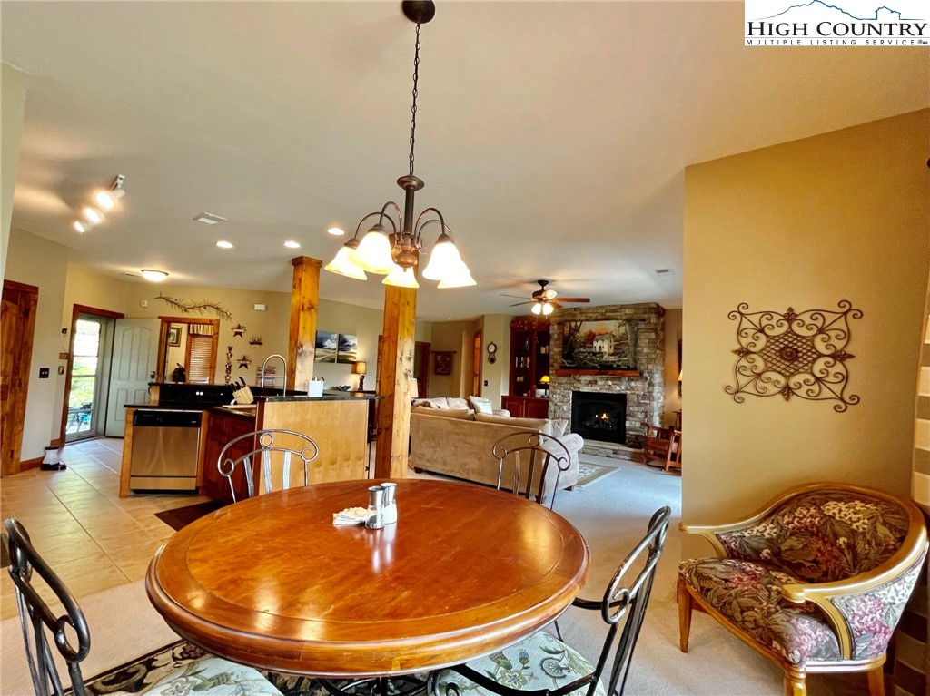 114 Red Deer Road, Unit D Banner Elk, NC 28604 - Photo 11 of 40 a dining room with furniture and wooden floor