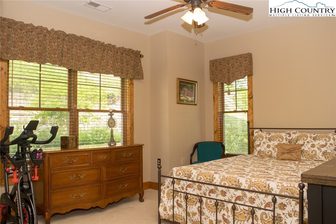 114 Red Deer Road, Unit D Banner Elk, NC 28604 - Photo 28 of 40 a bedroom with a bed and a window