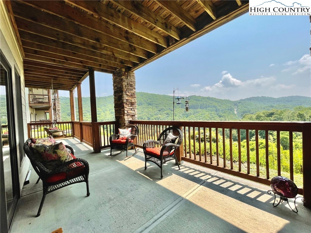 114 Red Deer Road, Unit D Banner Elk, NC 28604 - Photo 30 of 40 a balcony with furniture and outdoor space