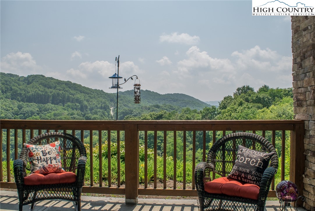 114 Red Deer Road, Unit D Banner Elk, NC 28604 - Photo 3 of 40 a view of a chair and table in patio