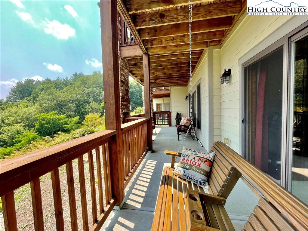 114 Red Deer Road, Unit D Banner Elk, NC 28604 - Photo 31 of 40 a view of a balcony with chairs