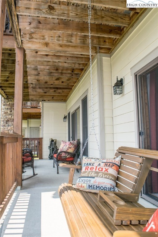 114 Red Deer Road, Unit D Banner Elk, NC 28604 - Photo 32 of 40 a view of a patio with couches and potted plants