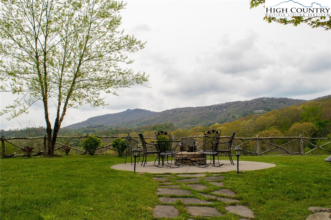 114 Red Deer Road, Unit D Banner Elk, NC 28604 - Photo 38 of 40 a view of a garden with an outdoor seating