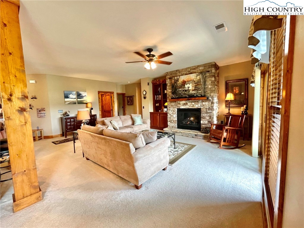 114 Red Deer Road, Unit D Banner Elk, NC 28604 - Photo 6 of 40 a living room with furniture and a fireplace