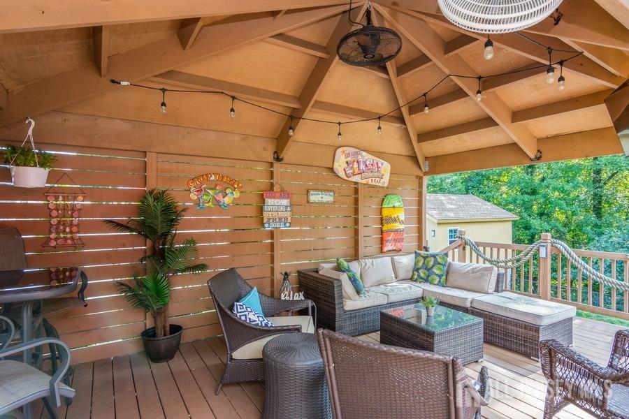27 Brookside Road Edison, NJ 08817 - Photo 25 of 30 a view of a patio with couches table and chairs and potted plants