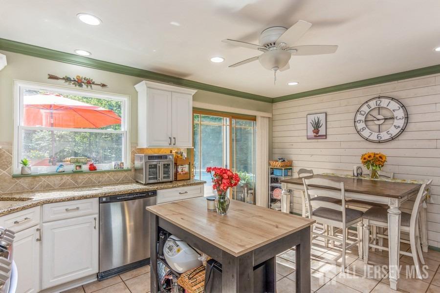 27 Brookside Road Edison, NJ 08817 - Photo 5 of 30 a view of a dining table and chairs in a room