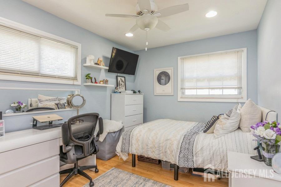27 Brookside Road Edison, NJ 08817 - Photo 10 of 30 a bedroom that has a bed and a desk in it with window