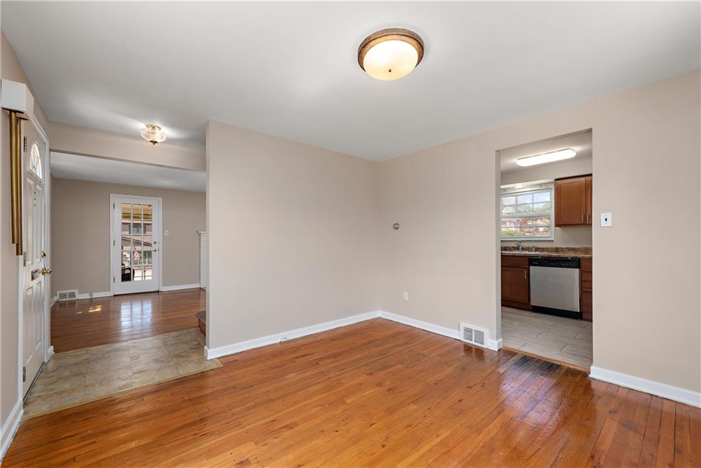 908 Greenhill Road Pittsburgh, PA 15209 - Photo 19 of 23 a view of a room with wooden floor and window