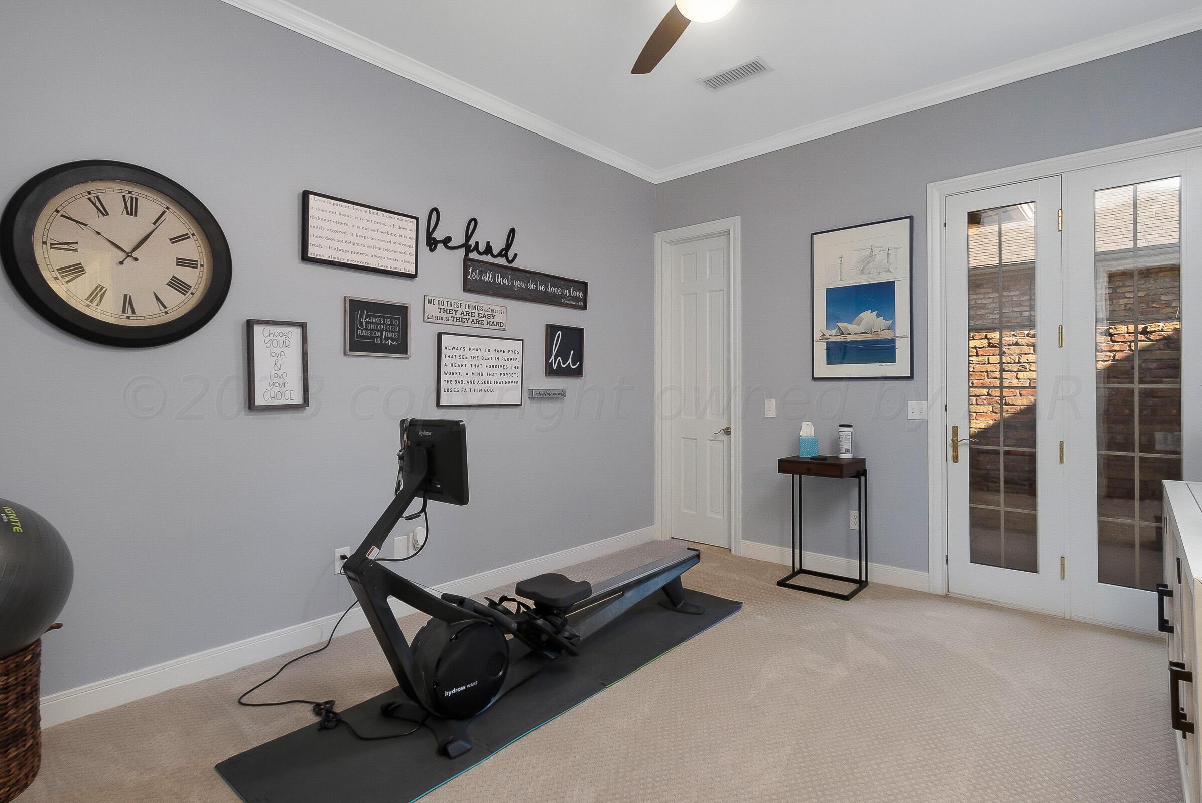 6202 Raintree Court Amarillo, TX 79119 - Photo 24 of 36 a view of a room with gym equipment