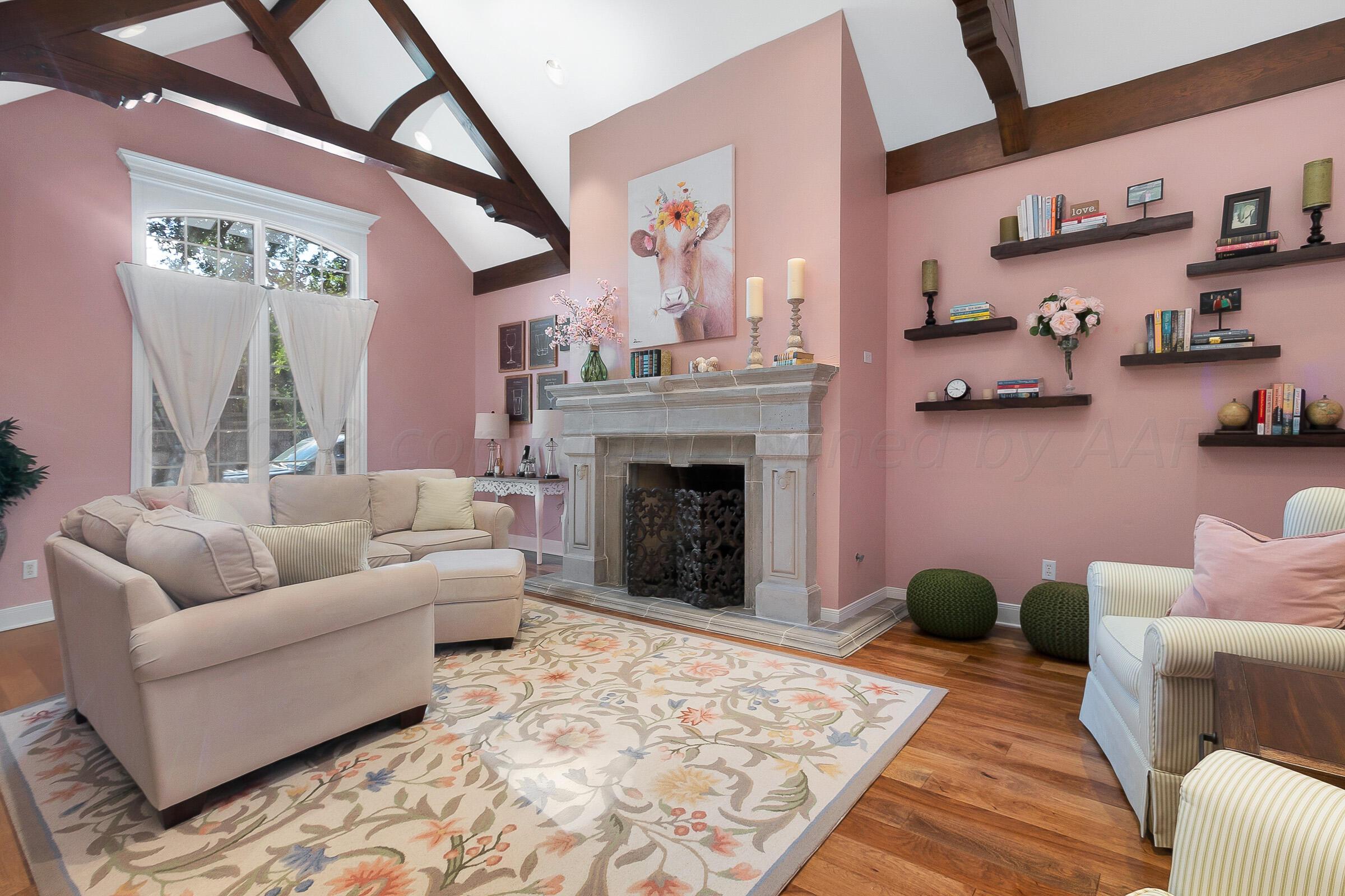 6202 Raintree Court Amarillo, TX 79119 - Photo 3 of 36 a living room with furniture and a fireplace