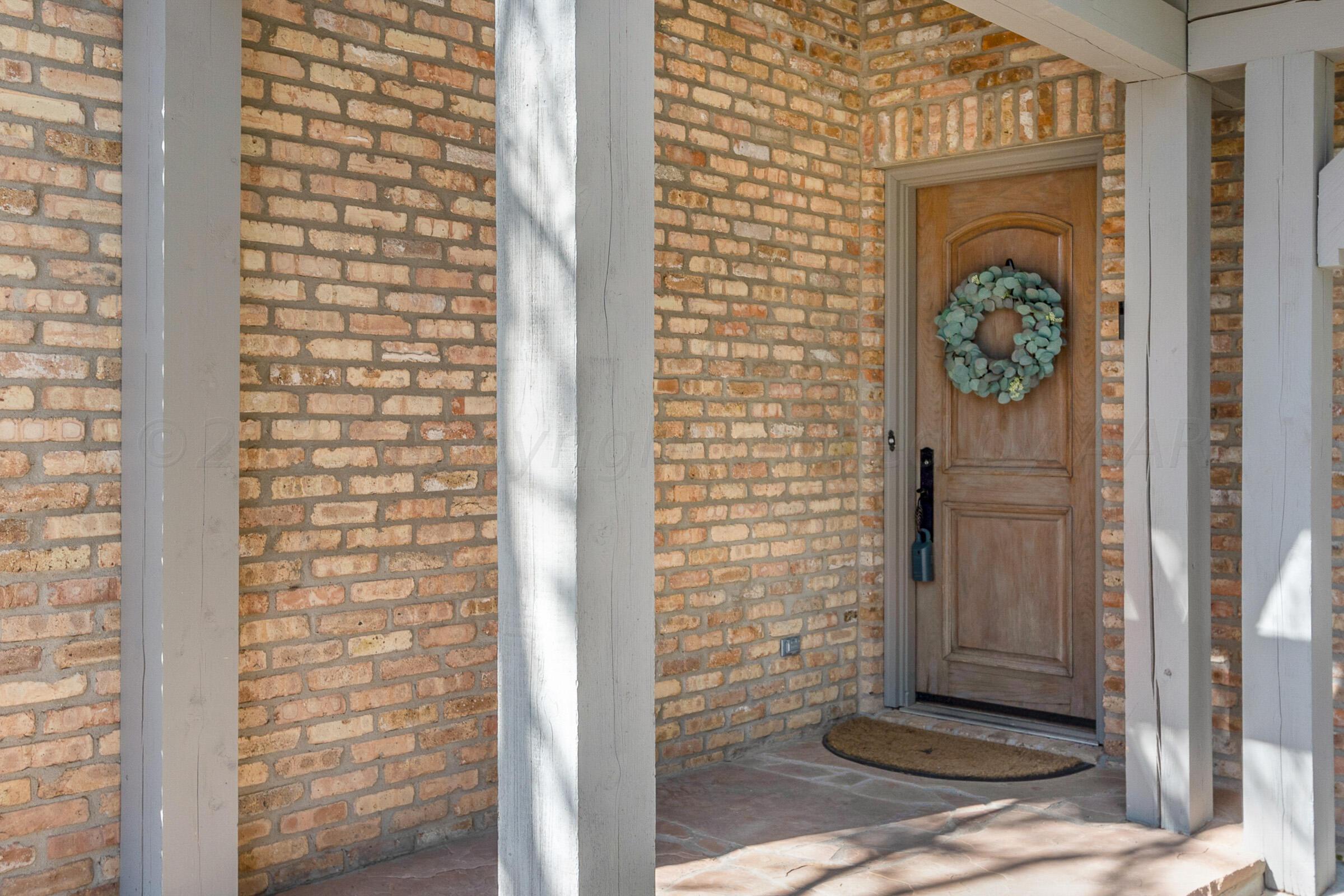 6202 Raintree Court Amarillo, TX 79119 - Photo 35 of 36 a front view of a house with a door