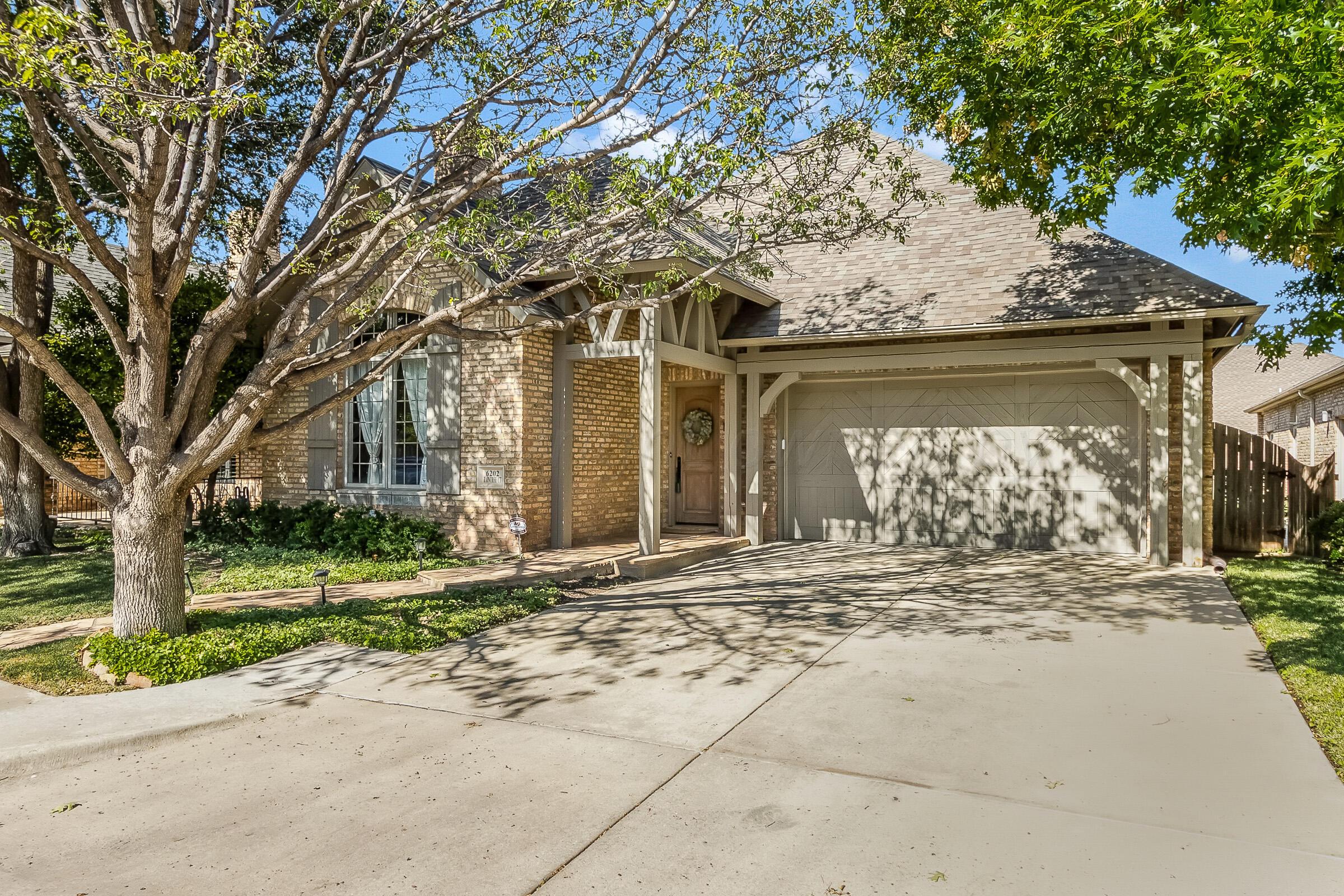 6202 Raintree Court Amarillo, TX 79119 - Photo 36 of 36 front view of a house with a trees
