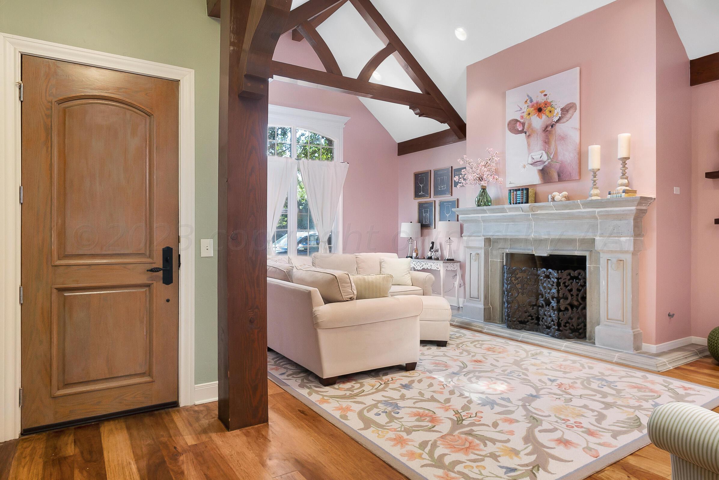 6202 Raintree Court Amarillo, TX 79119 - Photo 8 of 36 a living room with furniture and a fireplace