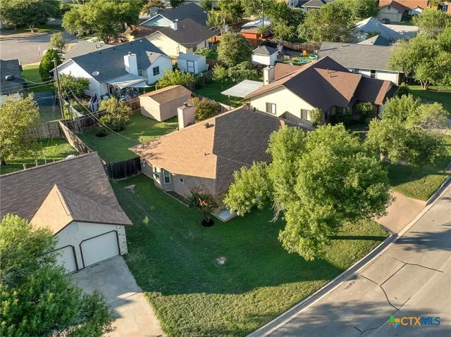 an aerial view of a house with a garden