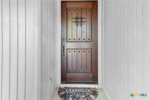 a view of an entryway with a door